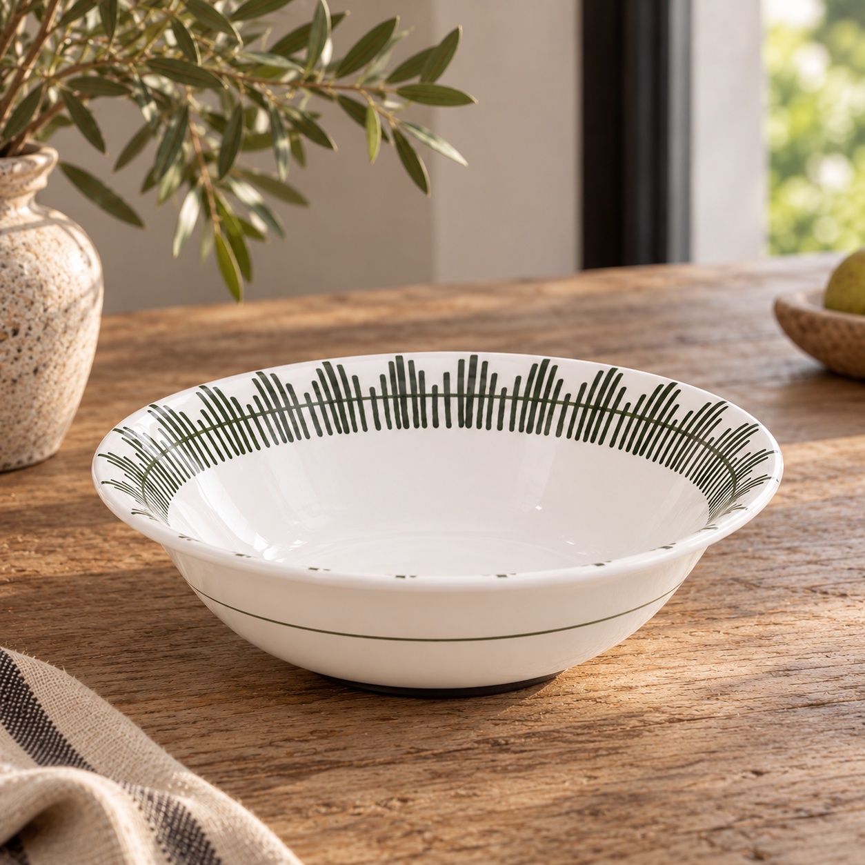 11.5-inch Giardino ceramic serving bowl on a sunlit wooden table