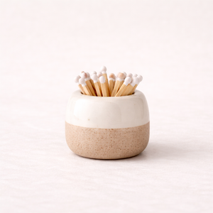 Ceramic match pot with a cream glazed rim, textured base and matches