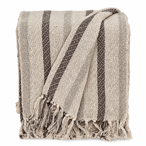 Beige and gray striped cotton throw folded on a white background
