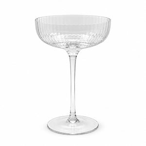 Ribbed clear coupe glass on a white background