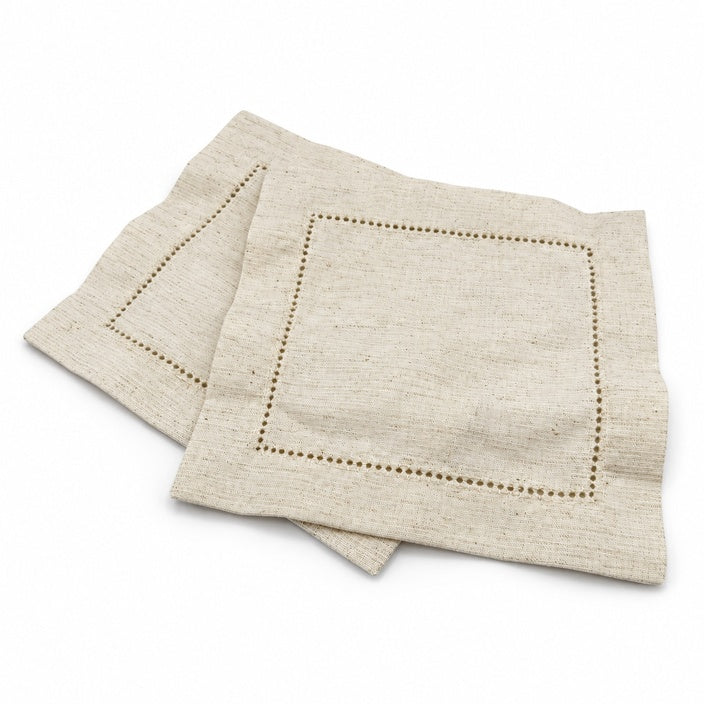 Two ivory hemstitch cocktail napkins on a white background