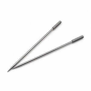 Two metal cocktail picks with textured handles on a white background