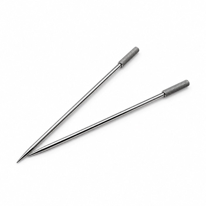 Two metal cocktail picks with textured handles on a white background
