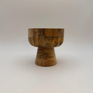 Wooden pedestal bowl with a narrow raised base, side view
