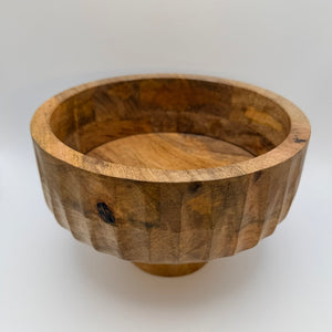 Wide wooden bowl with a rounded rim, viewed at an angle