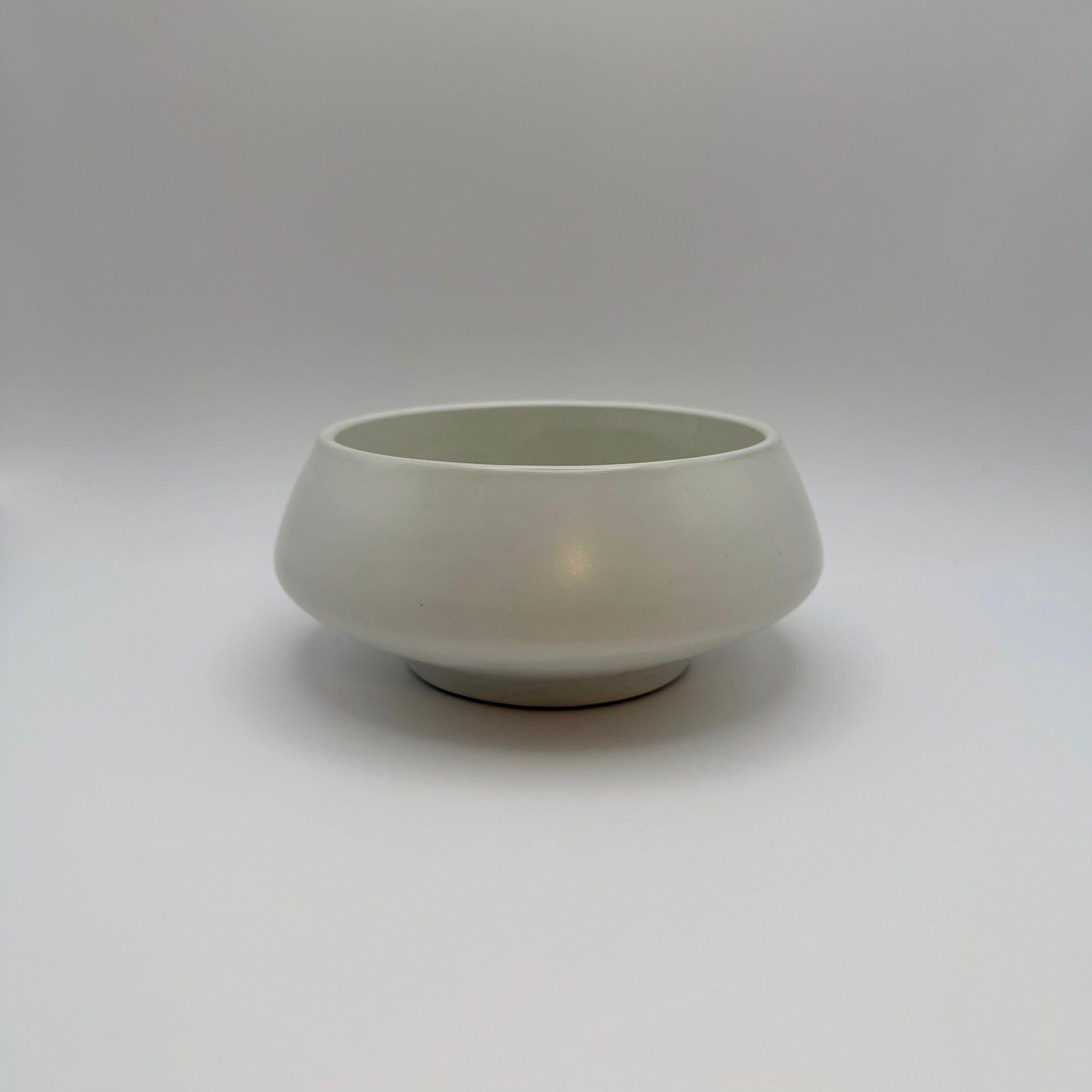 White ceramic decorative bowl on a light background