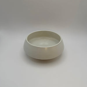 White ceramic bowl showing its rounded rim and interior