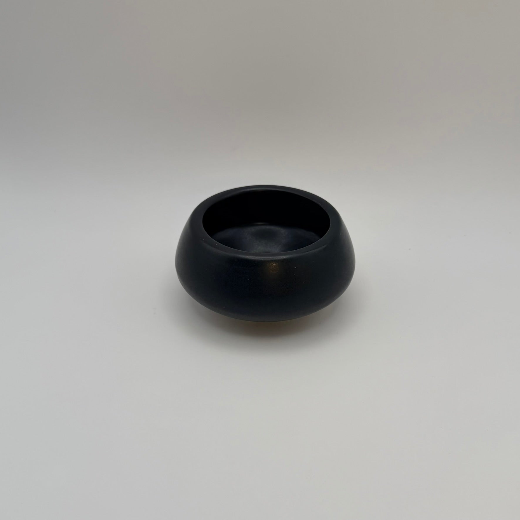 Black ceramic decorative bowl viewed from above