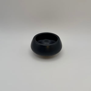 Black ceramic decorative bowl viewed from above