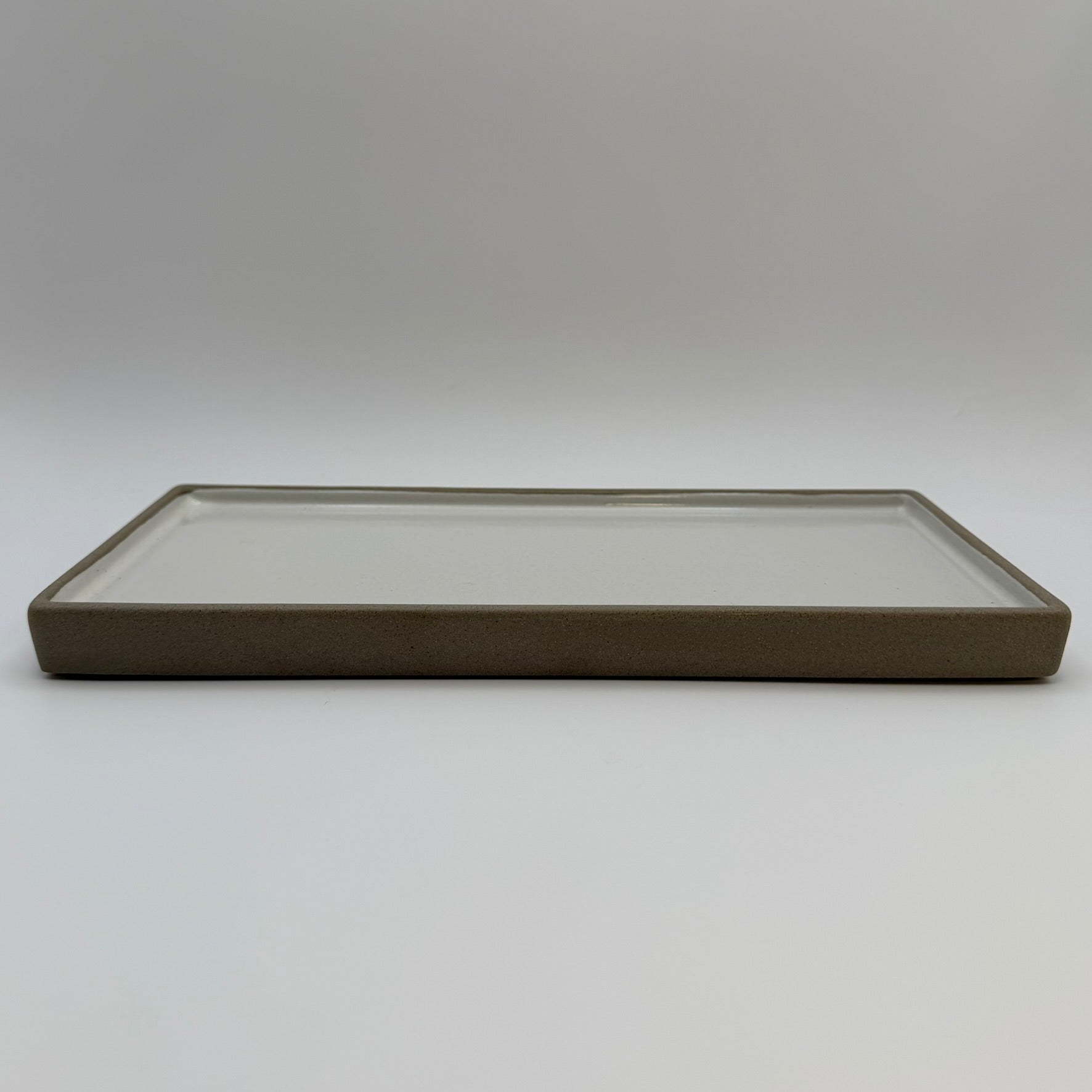 Rectangular ceramic candle tray viewed from the front