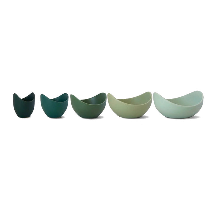 Set of five Natalia stoneware bowls in graduated green shades arranged on a white background