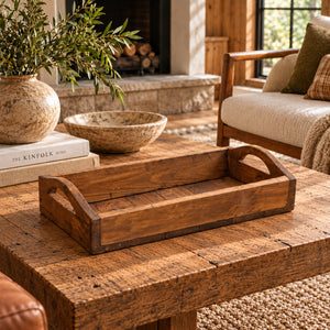 Reclaimed wood serving tray with handles on a coffee table