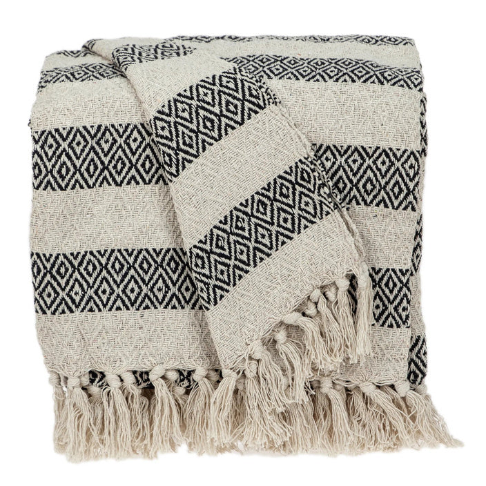 Beige Rosie cotton throw with black geometric bands and fringe on a white background