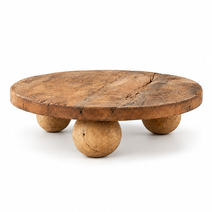 Round reclaimed wood riser on a white background