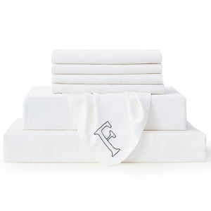Full-size Bambusa white seven-piece sheet set with an embroidered F marker on a white background